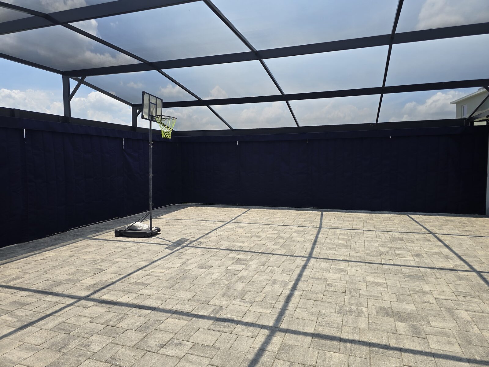 Privacy curtains enclosing a screened patio with a fire pit
