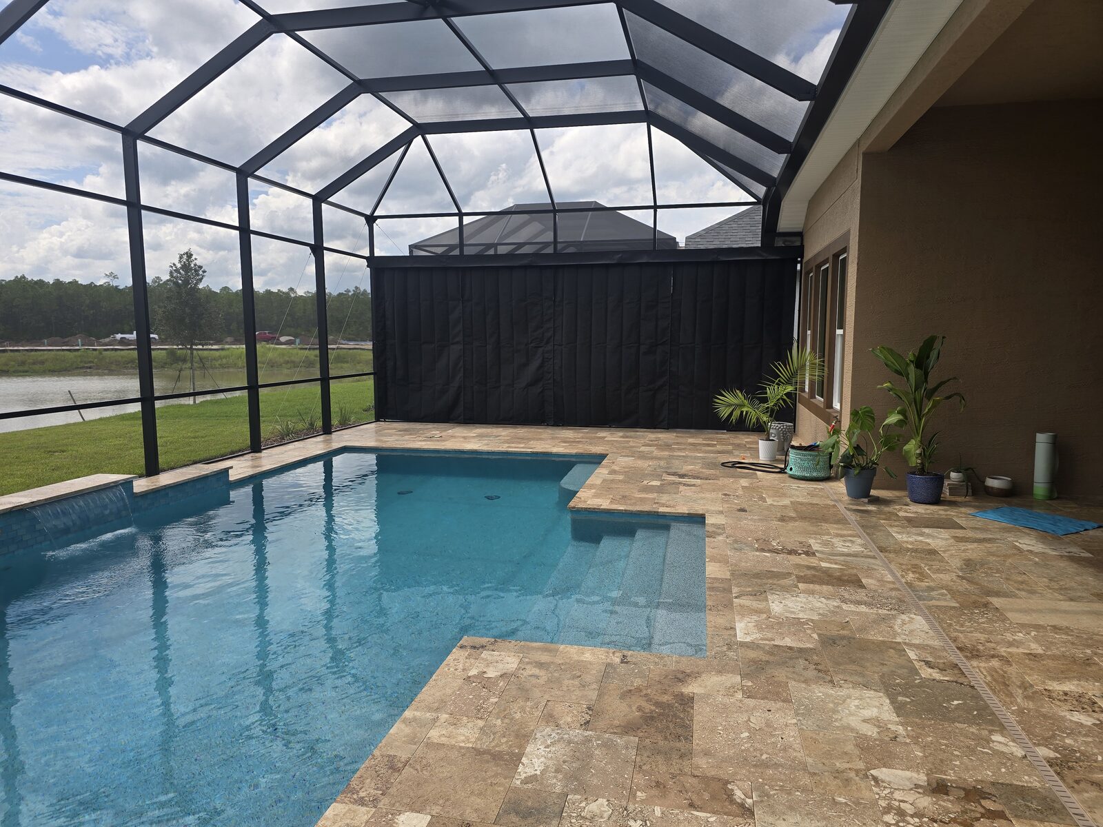 Privacy On Demand outdoor privacy curtains on a screened Florida pool lanai