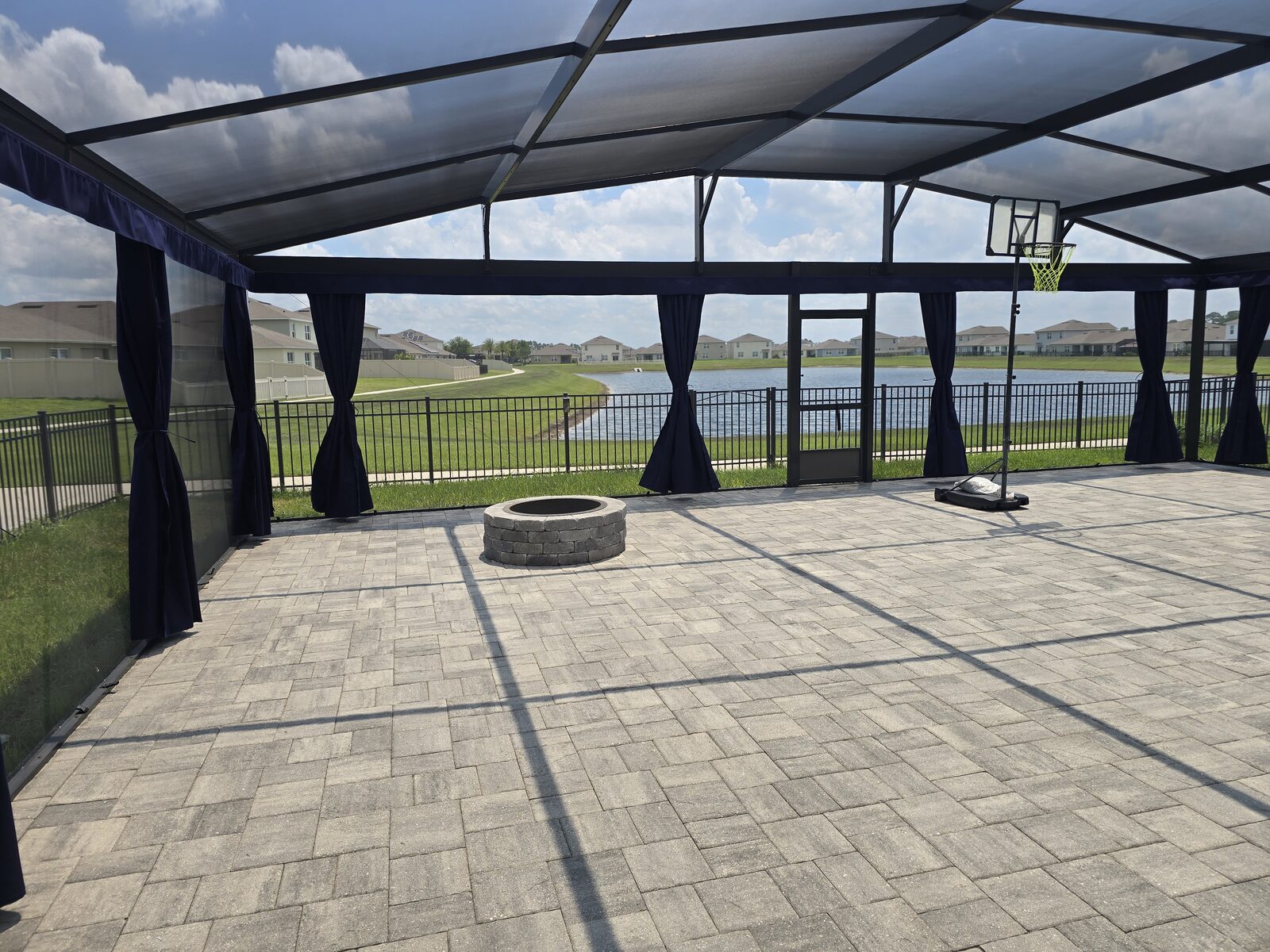 A wide screen enclosure fitted with privacy curtains
